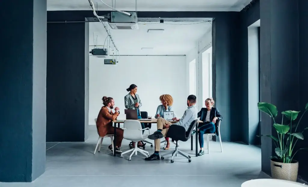 A group of people sitting around a table.