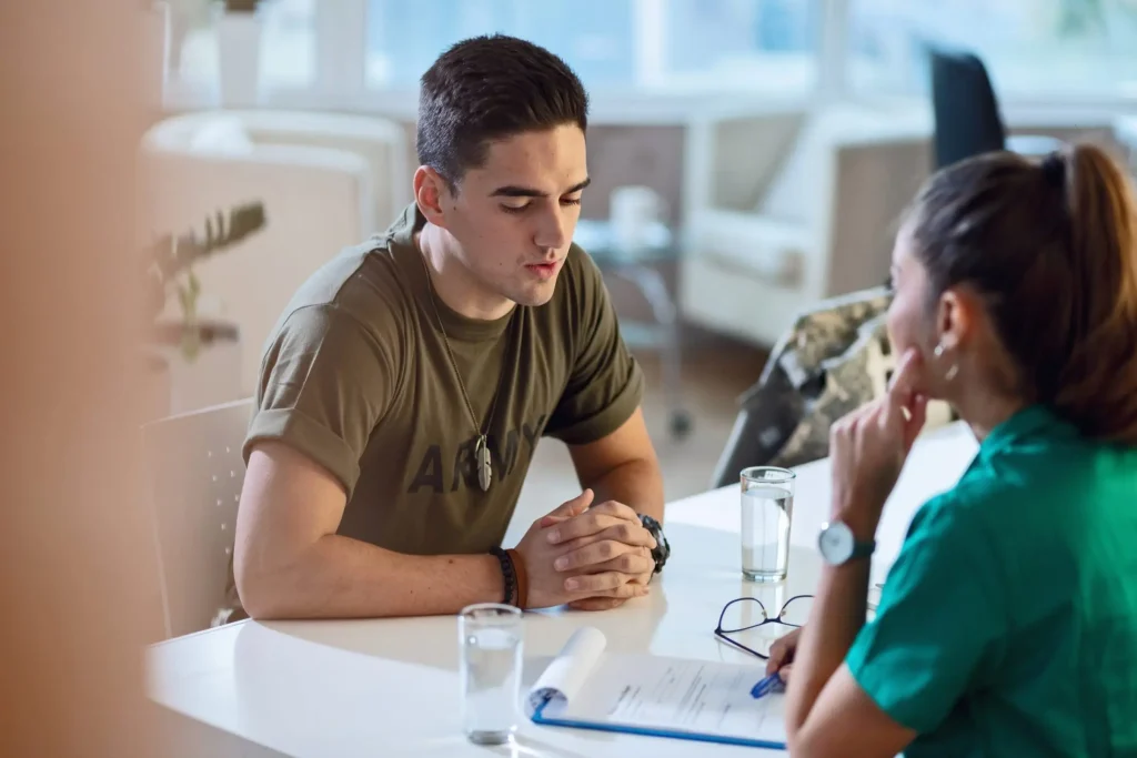 A military man talking to a councellor