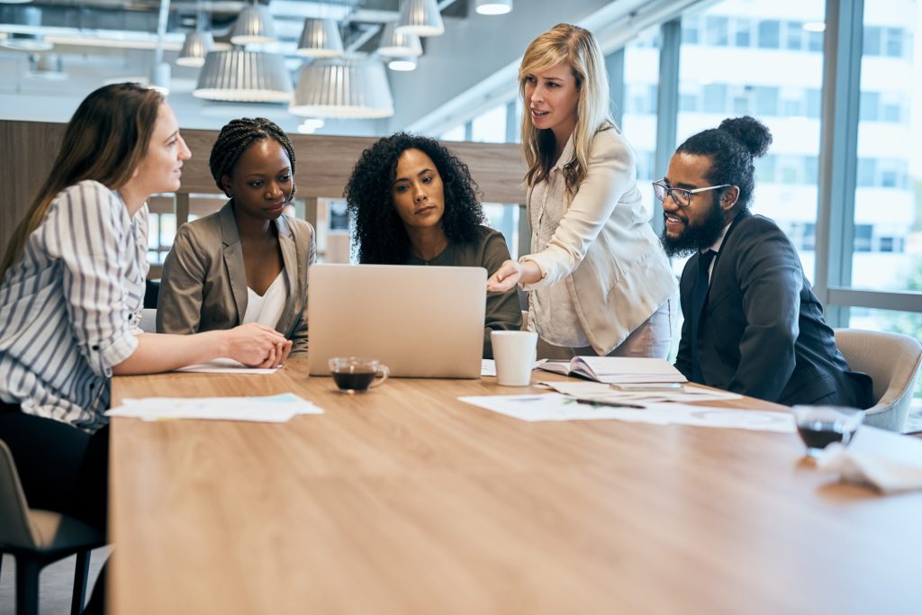 A group of business people in a meeting stock photo.