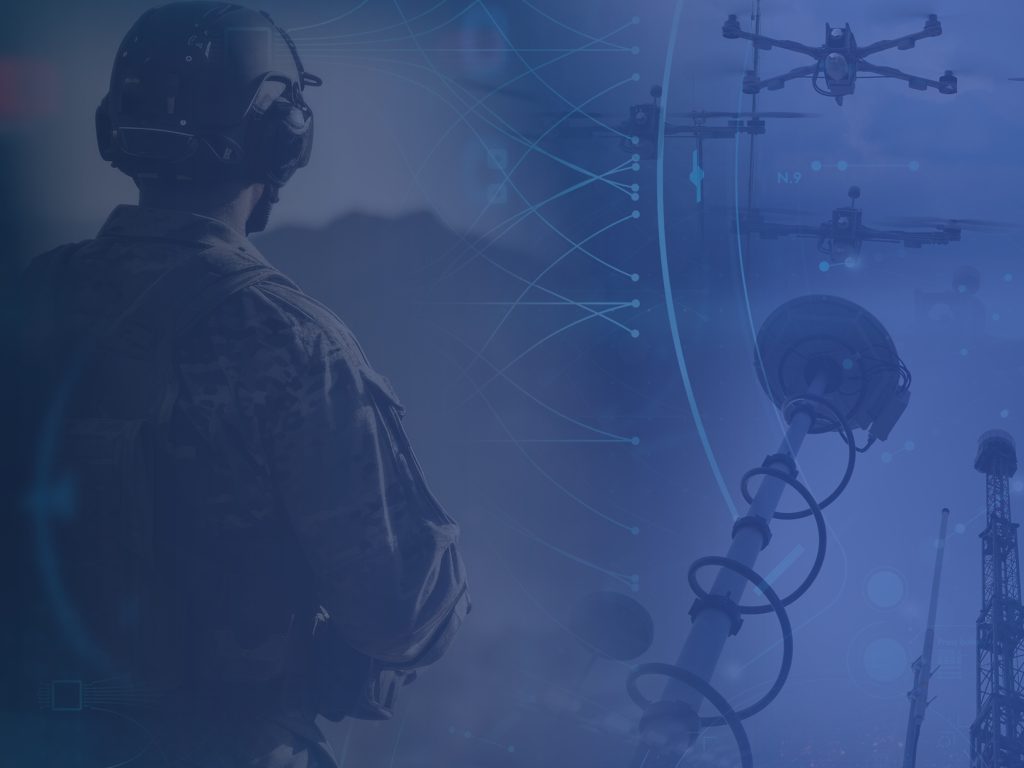 A soldier in tactical gear observes drones and satellite equipment, with digital network graphics overlaying the scene.