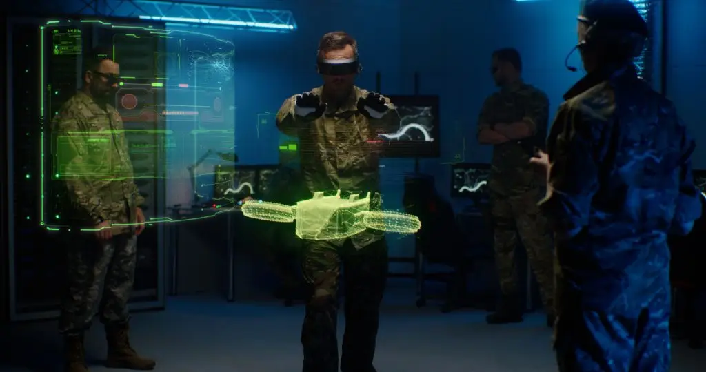 Group of servicemen in VR goggles testing model of military drone in holographic program
