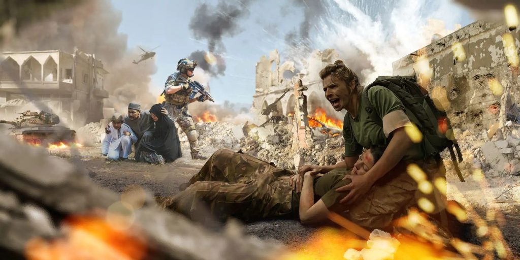 A soldier kneels beside an injured comrade in a war-torn area, with buildings in ruins, smoke rising, and a helicopter in the sky. Another armed soldier and civilians are in the background.