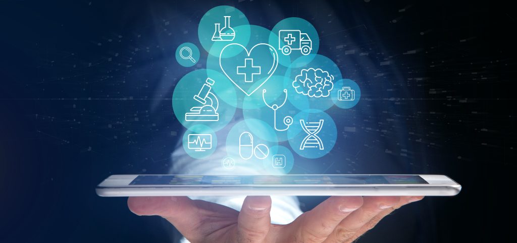 A hand holding a smartphone displays floating medical icons, including a heart, stethoscope, brain, and microscope, symbolizing digital healthcare technology.