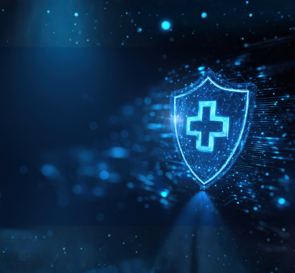 Digital illustration of a glowing blue shield with a medical cross symbol, representing healthcare protection or cybersecurity, on a dark background.