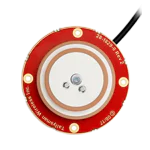 Red circular electronic component with a white center, featuring gold and silver accents, connected by a black cable.