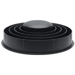 A black, round, multi-layered object with a smooth, dome-like top is displayed against a plain background.