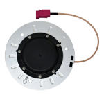 A round electronic component with a central black area and a surrounding metallic ring. It is attached to a brown cable with a red connector.