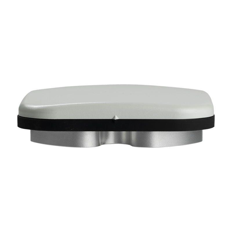 A silver and black rectangular object with curved edges, viewed from the side against a white background.
