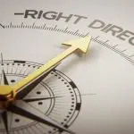 A gold compass needle points toward the words "RIGHT DIRECTION" printed on a white background.