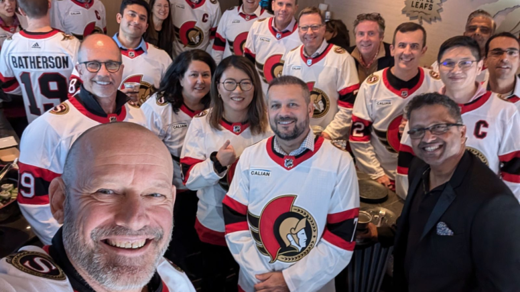 Calian team at winning Ottawa Senators hockey game in new away jerseys.